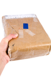 holding brown paper package