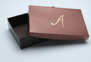 Rigid box with black finish interior by Salazar Packaging